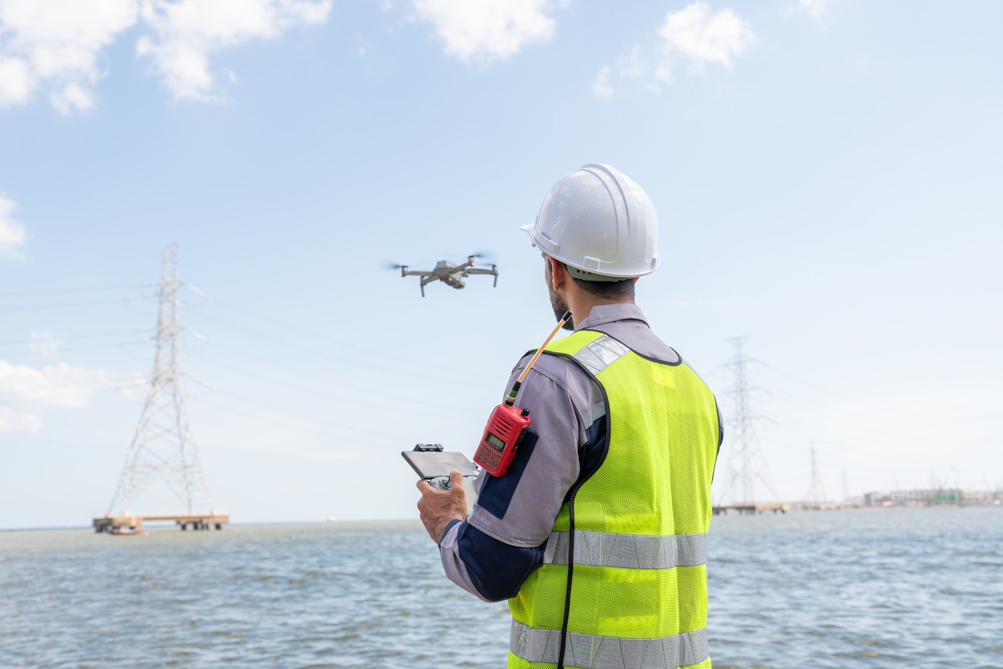A pilot using a drone to complete drone services and inspections for a customer